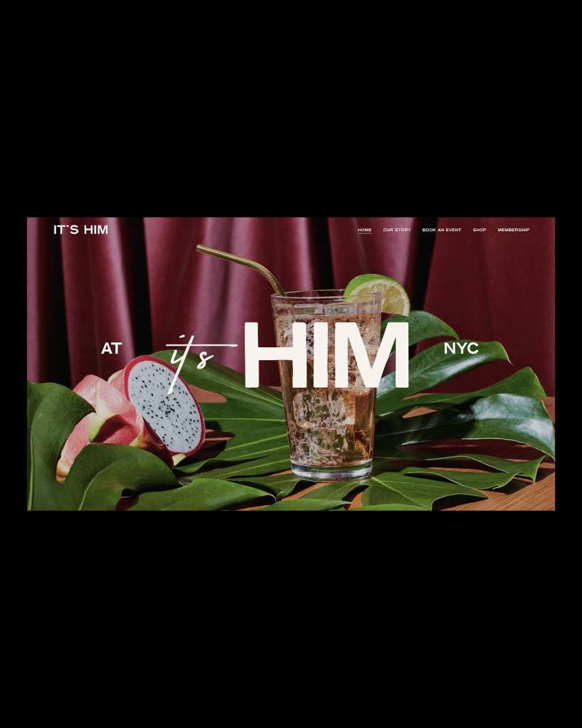 A bright, close-up photograph of a vibrant cocktail served in a tall glass with ice and a lime wedge, resting on large green monstera leaves. In the foreground, a halved pink dragon fruit is visible, and large white text overlaid on the image reads "AT it's HIM NYC," with a deep maroon curtain serving as the background.